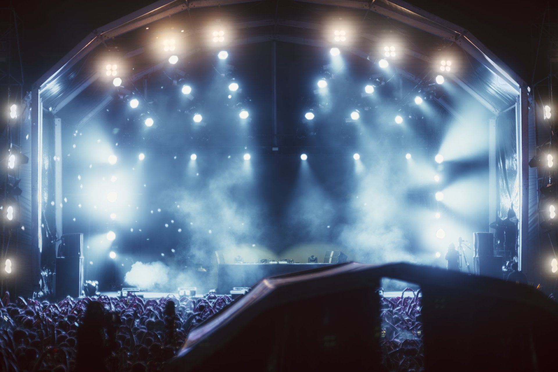 Nighttime concert scene with bright stage lighting
